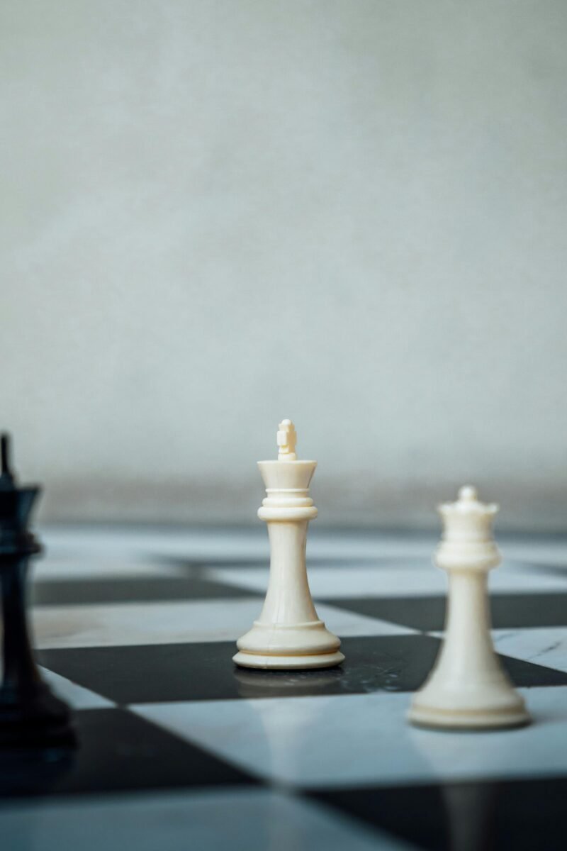 Chess pieces on a checkered board representing strategic gameplay in Ciudad de México.